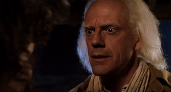 Movie still from “Back to the Future Part III” (1990), directed by Robert Zemeckis – An old man with white hair and a white wig; Close Up shot, Low angle