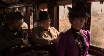 Movie still from “Back to the Future Part III” (1990), directed by Robert Zemeckis – An older man and woman sitting on a train; Medium shot, Over the shoulder angle