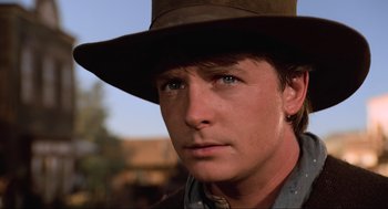 Movie still from “Back to the Future Part III” (1990), directed by Robert Zemeckis – A person wearing a hat; Close Up shot, Low angle