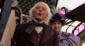 Movie still from “Back to the Future Part III” (1990), directed by Robert Zemeckis – A man and a woman dressed up in costumes; Medium shot, Low angle