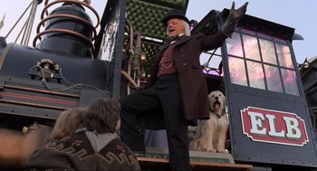 Movie still from “Back to the Future Part III” (1990), directed by Robert Zemeckis – An old man standing on top of a train; Medium shot, Low angle