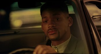 Movie still from “Bad Boys” (1995), directed by Michael Bay – A person driving a car; Close Up shot, Over the shoulder angle