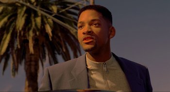 Movie still from “Bad Boys” (1995), directed by Michael Bay – A man in a suit and jacket looking to his left; Close Up shot, Low angle