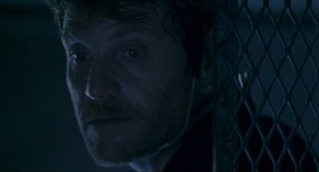 Movie still from “Bad Boys” (1995), directed by Michael Bay – A person wearing a headset; Close Up shot, Over the shoulder angle