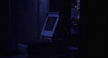 Movie still from “Bad Boys” (1995), directed by Michael Bay – A computer monitor sitting on top of a computer desk; Extreme Close Up shot, High angle