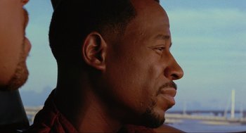 Movie still from “Bad Boys” (1995), directed by Michael Bay – A man's face looking off into the distance; Close Up shot, Low angle