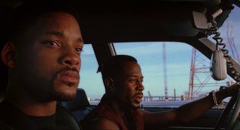Movie still from “Bad Boys” (1995), directed by Michael Bay – Two men in a car looking out the window; Close Up shot, Low angle