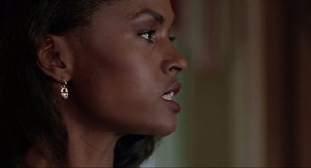 Movie still from “Bad Boys” (1995), directed by Michael Bay – A woman's face looking to the side; Close Up shot, Low angle