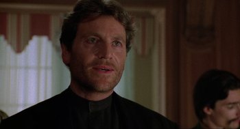 Movie still from “Bad Boys” (1995), directed by Michael Bay – A person wearing a black shirt; Close Up shot, Low angle