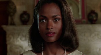 Movie still from “Bad Boys” (1995), directed by Michael Bay – An image of a woman with a necklace; Close Up shot, Over the shoulder angle