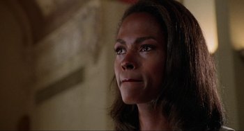 Movie still from “Bad Boys” (1995), directed by Michael Bay – A person with long hair; Close Up shot, Over the shoulder angle