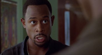 Movie still from “Bad Boys” (1995), directed by Michael Bay – A person looking at a mirror; Close Up shot, Over the shoulder angle