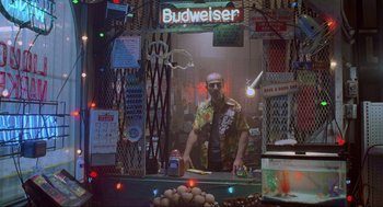 Movie still from “Bad Boys” (1995), directed by Michael Bay – A man standing in front of a store window; Wide shot, Low angle