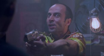 Movie still from “Bad Boys” (1995), directed by Michael Bay – A man holding a video camera in his hand; Close Up shot, Low angle