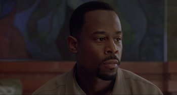 Movie still from “Bad Boys” (1995), directed by Michael Bay – A person wearing a jacket; Close Up shot, Low angle