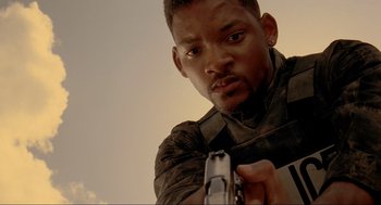 Movie still from “Bad Boys” (1995), directed by Michael Bay – A man holding a gun in his hand; Close Up shot, Low angle