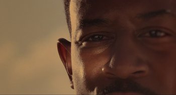 Movie still from “Bad Boys” (1995), directed by Michael Bay – A man's eyes and ear; Extreme Close Up shot, Low angle