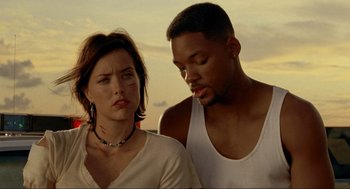 Movie still from “Bad Boys” (1995), directed by Michael Bay – A man and a woman standing next to each other; Close Up shot, Low angle