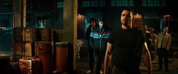 Movie still from “Bad Boys for Life” (2020), directed by Adil El Arbi – A group of men standing next to each other in a room; Medium shot, Over the shoulder angle