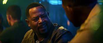 Movie still from “Bad Boys for Life” (2020), directed by Adil El Arbi – A man in a leather jacket talking to another man; Close Up shot, Over the shoulder angle