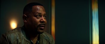 Movie still from “Bad Boys for Life” (2020), directed by Adil El Arbi – A person wearing a leather jacket; Close Up shot, Over the shoulder angle