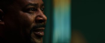 Movie still from “Bad Boys for Life” (2020), directed by Adil El Arbi – A man's face with tears coming out of his eyes; Extreme Close Up shot, Low angle