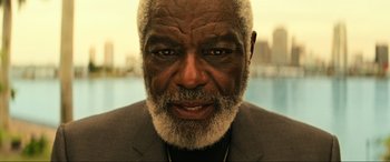 Movie still from “Bad Boys for Life” (2020), directed by Adil El Arbi – An older man with a beard and a necklace; Close Up shot, Low angle