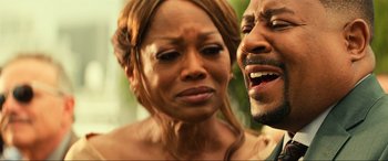 Movie still from “Bad Boys for Life” (2020), directed by Adil El Arbi – A man and a woman standing next to each other; Close Up shot, Over the shoulder angle