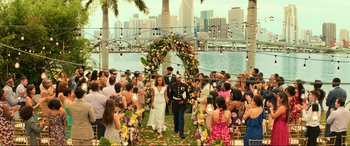 Movie still from “Bad Boys for Life” (2020), directed by Adil El Arbi – A couple walking down the aisle at a wedding ceremony; Extreme Wide shot, Over the shoulder angle