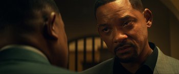 Movie still from “Bad Boys for Life” (2020), directed by Adil El Arbi – A man looking at another man in a suit; Close Up shot, Over the shoulder angle