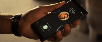 Movie still from “Bad Boys for Life” (2020), directed by Adil El Arbi – A person holding a phone in their hand; Extreme Close Up shot, Overhead angle