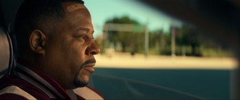 Movie still from “Bad Boys for Life” (2020), directed by Adil El Arbi – A person in a car looking out the window; Close Up shot, Low angle