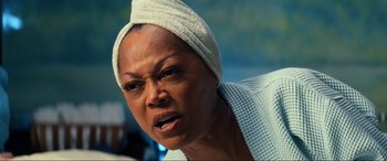 Movie still from “Bad Boys for Life” (2020), directed by Adil El Arbi – An older woman with a towel wrapped around her head; Close Up shot, Low angle