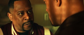 Movie still from “Bad Boys for Life” (2020), directed by Adil El Arbi – Two men talking to each other in front of a mirror; Close Up shot, Over the shoulder angle