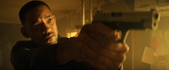 Movie still from “Bad Boys for Life” (2020), directed by Adil El Arbi – A person holding a gun; Close Up shot, Low angle