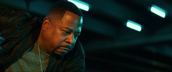 Movie still from “Bad Boys for Life” (2020), directed by Adil El Arbi – A person sitting down with his head down; Close Up shot, Low angle