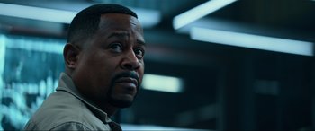 Movie still from “Bad Boys for Life” (2020), directed by Adil El Arbi – A man that is looking at something; Close Up shot, Low angle