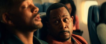 Movie still from “Bad Boys for Life” (2020), directed by Adil El Arbi – A man sitting in a chair with another man next to him; Close Up shot, Over the shoulder angle