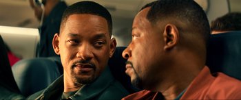 Movie still from “Bad Boys for Life” (2020), directed by Adil El Arbi – Two black men sitting next to each other on a bus; Close Up shot, Over the shoulder angle