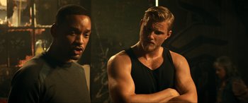 Movie still from “Bad Boys for Life” (2020), directed by Adil El Arbi – A man standing next to another man with his arms crossed; Medium shot, Over the shoulder angle