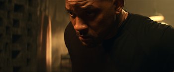 Movie still from “Bad Boys for Life” (2020), directed by Adil El Arbi – A man's face in a dark room; Close Up shot, Low angle