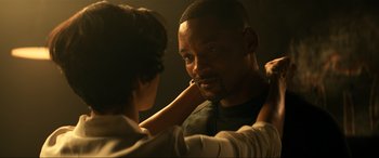 Movie still from “Bad Boys for Life” (2020), directed by Adil El Arbi – A woman is putting lipstick on a man's face; Close Up shot, Over the shoulder angle