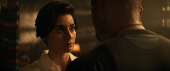 A man and a woman are talking to each other