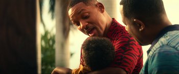 Movie still from “Bad Boys for Life” (2020), directed by Adil El Arbi – A person holding a baby; Close Up shot, Over the shoulder angle