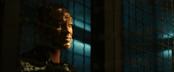 Movie still from “Bad Boys for Life” (2020), directed by Adil El Arbi – A person in a dark room; Close Up shot, Low angle