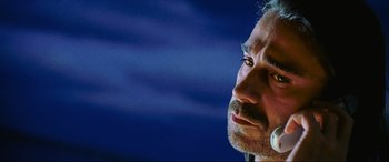 Movie still from “Bad Boys II” (2003), directed by Michael Bay – A person wearing a headset; Close Up shot, Low angle