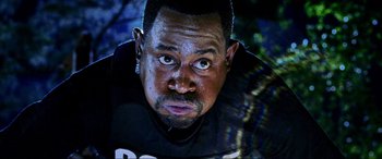 Movie still from “Bad Boys II” (2003), directed by Michael Bay – A man's face in the dark; Close Up shot, Low angle