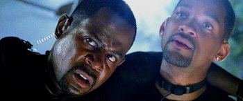 Movie still from “Bad Boys II” (2003), directed by Michael Bay – A man with his mouth wide open and another man with his head down; Close Up shot, Low angle