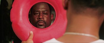 Movie still from “Bad Boys II” (2003), directed by Michael Bay – A man looking at himself in a mirror; Close Up shot, Over the shoulder angle