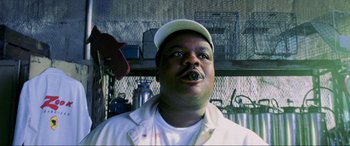 Movie still from “Bad Boys II” (2003), directed by Michael Bay – A person wearing a hat; Close Up shot, Low angle